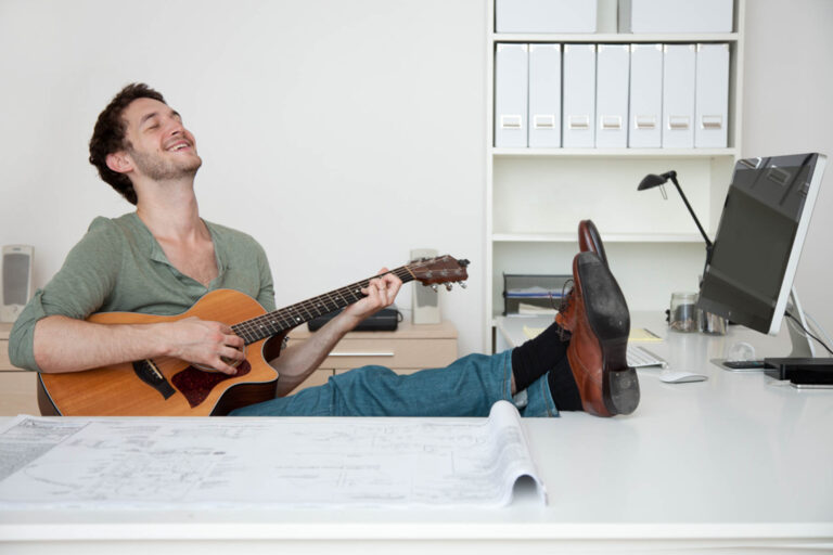 Office worker playing guitar