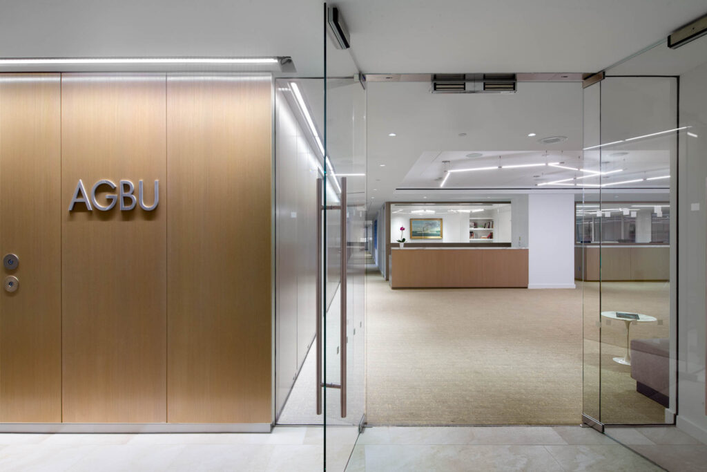 Kahn Architecture designed this beautiful office for the American General Benevolent Union in Manhattan. As an interior design photographer, I love the wood and the glass together in this space.